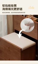 Wooden makeup vanity with mirror and stool in a modern bedroom setting