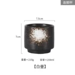 Japanese ceramic beer mug filled with amber ale, showcasing traditional glaze and ergonomic handle