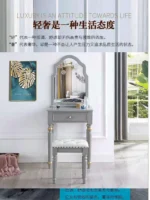 Modern white dressing table with mirror and stool in a bedroom setting