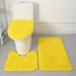 Plush bathroom rug set with toilet lid cover and mat in a modern bathroom