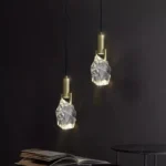 Modern crystal pendant lamp illuminating a dining room with elegant light refraction