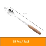 Stainless steel flatware set with wooden handles displayed on a table
