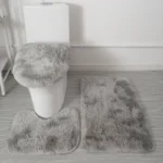 Plush bathroom rug set with toilet lid cover and mat in a cozy bathroom