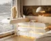 Modern 2-tier dressing table organizer with makeup and brushes on a white vanity
