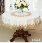 Elegant lace tablecloth with rose gold embroidery on a dining table