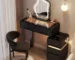 Modern dressing table with mirror and stool in a bright bedroom setting