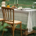 Retro polka dot tablecloth with fringe on a wooden table