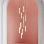 The pendant light in a living room, casting a warm glow over a seating area.