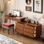 Minimalist oak wood dressing table with mirror, stool, and six drawers in a modern bedroom setting