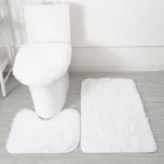 Plush bathroom rug set with toilet lid cover and mat in a cozy bathroom