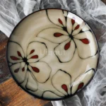 Ceramic dinnerware set with Japanese flat serving plates in floral Nordic design