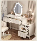 Modern wood makeup vanity table with mirror, drawer, and stool in a bedroom setting