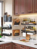 Stainless steel wall mounted dish rack holding plates and bowls in a modern kitchen