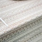 Retro polka dot tablecloth with fringe on a wooden table
