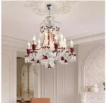 Modern red crystal chandelier with clear red K9 crystals hanging in a living room
