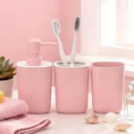 Close-up of the pink soap dispenser showing its glossy ceramic finish.