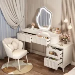 Modern wood makeup vanity table with mirror, drawer, and stool in a bedroom setting