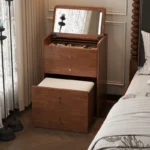 Wooden makeup vanity with mirror and stool in a modern bedroom setting