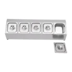 Stainless steel spice rack with 5 pans and lids on kitchen countertop
