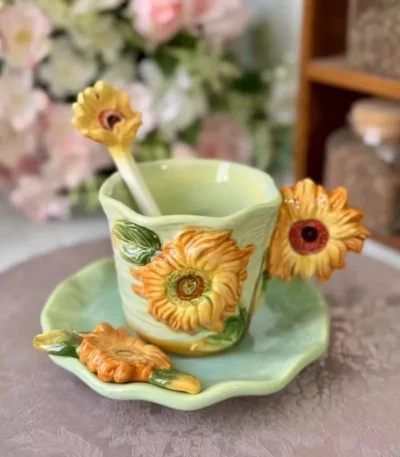 Hand-drawn sunflower coffee mug with underglaze color on white ceramic