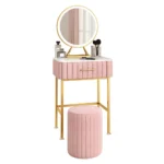 Marble top dressing table with lighted mirror and stool in a bedroom setting