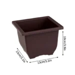 Three rectangular pots with trays, arranged on patio floor.