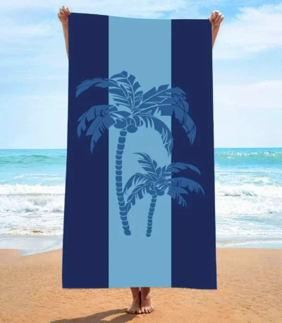 Blue striped palm tree print quick dry beach towel on sand