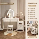 Modern wood makeup vanity table with mirror, drawer, and stool in a bedroom setting