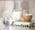 Colorful stones dots borosilicate glass tumbler with water on a wooden table