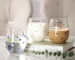 Colorful stones dots borosilicate glass tumbler with water on a wooden table