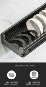 Stainless steel wall mounted dish rack holding plates and bowls in a modern kitchen