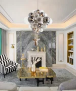 Smoky gray chandelier with glass bubbles hanging over a modern dining table