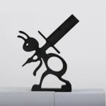 Overhead shot of the ant toilet paper holder on a glass tabletop, with a blurred background.