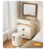Modern lifting vanity table with mirror in cream finish, featuring rotating top and adjustable height for bedroom use