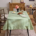 French country tablecloth with retro plaid pattern and lotus leaf edge on a dining table
