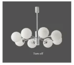 Chandelier installed in a high-ceiling foyer, drawing the eye upward with its elegant form.