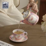 Elegant porcelain cups and saucers set on a wooden table