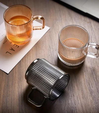 Japanese-style vertical stripes bamboo lid drinking glass with handle on wooden table