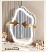 Modern wood makeup vanity table with mirror, drawer, and stool in a bedroom setting