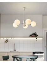 Chandelier at dusk, dim light creating a cozy atmosphere in a corner of the room.