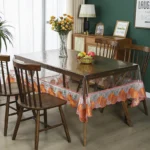 Elegant waterproof table protector with lace embroidery on a rectangular dining table