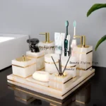 Natural marble golden soap dispenser on bathroom counter, soft lighting.