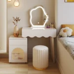 Modern makeup vanity desk with mirror and stool in a bedroom setting, showcasing ample storage and elegant design