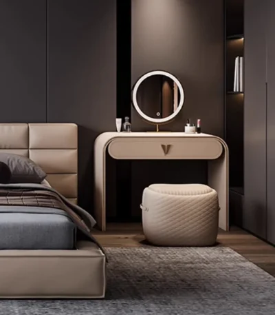Modern dressing table with LED mirror and stool in a bedroom showing illuminated makeup vanity