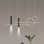 Modern chandelier with multiple gold arms and shades in a living room.