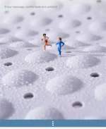 Non slip bath mat with suction cups in a white bathroom