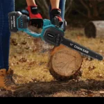 Cordless brushless chainsaw cutting a log in a garden