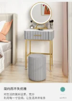 Marble top dressing table with lighted mirror and stool in a bedroom setting
