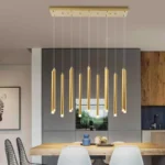 Matte black linear pendant light over a rustic farmhouse dining table.