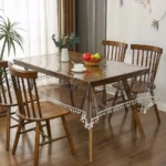 Elegant waterproof table cover with retro fringed lace on a dining table